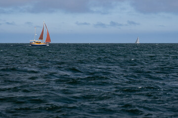 Sailing boat on blue open sea. Concept of Dream, adventure and freedom