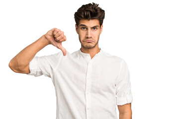 Young caucasian handsome man isolated showing a dislike gesture, thumbs down. Disagreement concept.