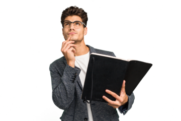 Young teacher caucasian man holding a book isolated