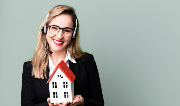 pretty caucasian woman with headset and real state concept