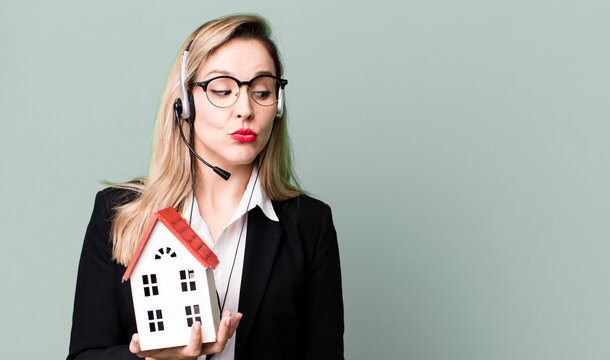 pretty caucasian woman with headset and real state concept