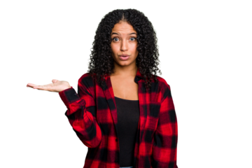 Young cute brazilian woman isolated impressed holding copy space on palm.