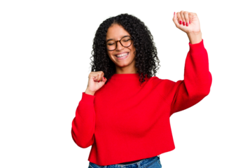Young cute brazilian woman isolated celebrating a special day, jumps and raise arms with energy.