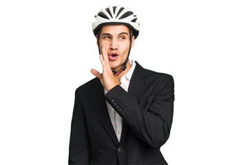 Business Caucasian man wearing a bike helmet isolated is saying a secret hot braking news and looking aside