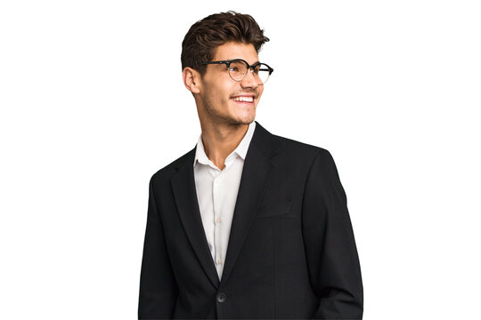 Young caucasian business man isolated looks aside smiling, cheerful and pleasant.