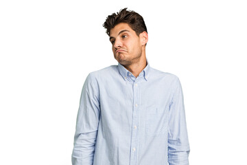 Young caucasian handsome man isolated shrugs shoulders and open eyes confused.
