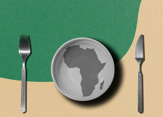 empty plate and cutlery on the background of the map of Africa. Art collage. Global crisis, food...