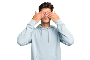 Young caucasian handsome man isolated afraid covering eyes with hands.