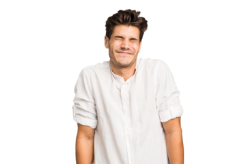 Young caucasian handsome man isolated laughs and closes eyes, feels relaxed and happy.