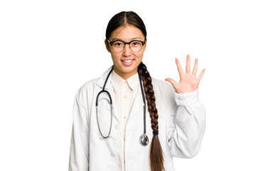 Young doctor asian woman isolated smiling cheerful showing number five with fingers.