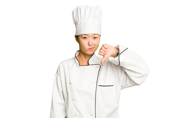 Young asian cook woman isolated showing a dislike gesture, thumbs down. Disagreement concept.