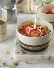 cereal with strawberries, сashews and milk