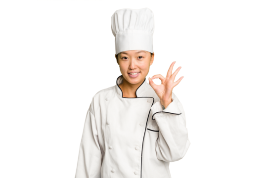 Young asian cook woman isolated cheerful and confident showing ok gesture.