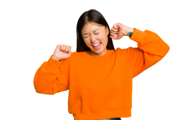 Young Asian woman isolated dancing and having fun.