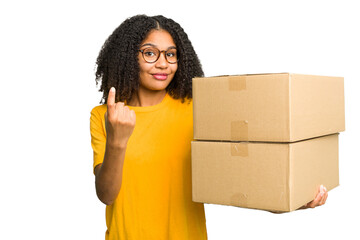 Young african american woman moving to other house while picking up a box full of things isolated...