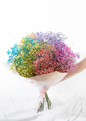 bouquet of flowers isolated on white with hand