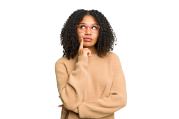 Young african american woman isolated contemplating, planning a strategy, thinking about the way of a business.