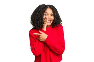 Young african american woman isolated saying a gossip, pointing to side reporting something.