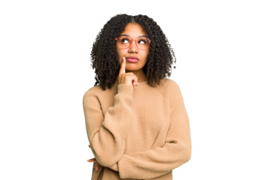 Young african american woman isolated contemplating, planning a strategy, thinking about the way of a business.