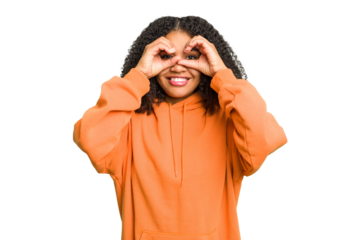 Young african american woman isolated showing okay sign over eyes