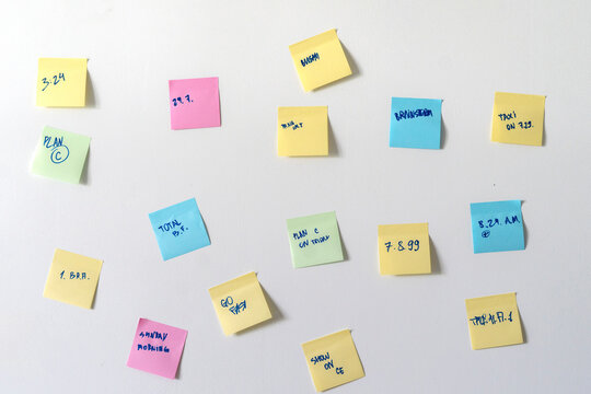 Colorful Paper Notes Attached On The Wall With Reminders In Office