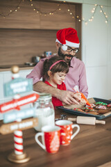 Family decorating gingerbread cookies