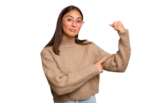 Young cute caucasian woman isolated showing strength gesture with arms, symbol of feminine power