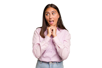 Young cute caucasian woman isolated praying for luck, amazed and opening mouth looking to front.