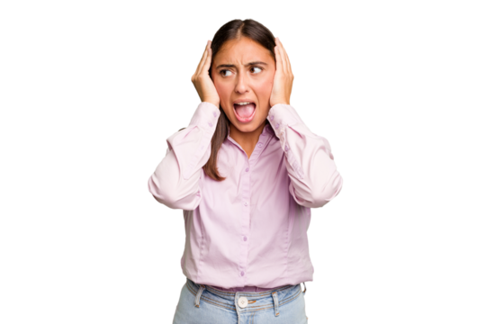 Young cute caucasian woman isolated covering ears with hands trying not to hear too loud sound.