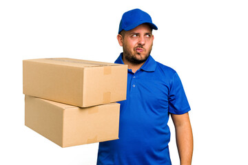 Delivery caucasian man isolated confused, feels doubtful and unsure.