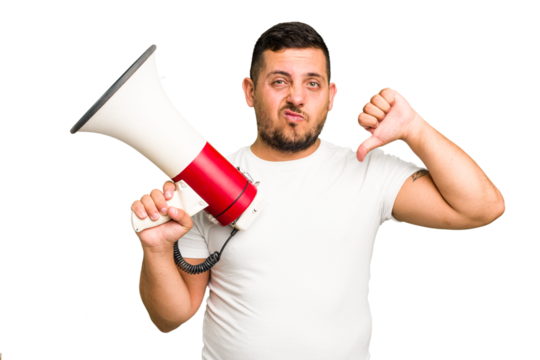 Young caucasian man holding a megaphone isolated showing a dislike gesture, thumbs down. Disagreement concept.