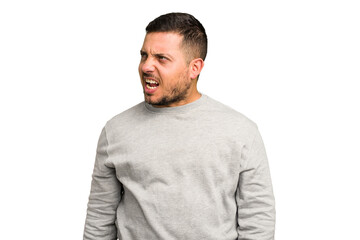 Fototapeta premium Young caucasian man isolated shouting very angry, rage concept, frustrated.