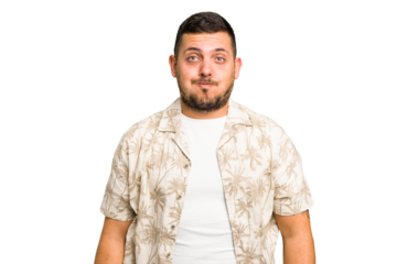 Young caucasian man isolated blows cheeks, has tired expression. Facial expression concept.