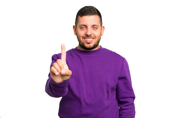 Young caucasian man isolated showing number one with finger.