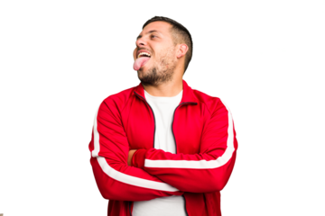 Young caucasian man isolated funny and friendly sticking out tongue.