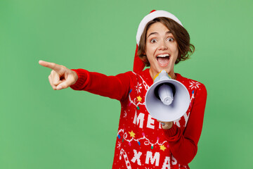 Merry fun young woman wear xmas sweater Santa hat posing hold scream in megaphone announces sale...