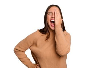 Young caucasian cute woman isolated having fun covering half of face with palm.