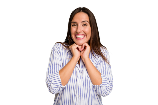 Young caucasian cute woman isolated keeps hands under chin, is looking happily aside.