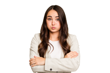 Young caucasian woman isolated on green chroma background blows cheeks, has tired expression. Facial expression concept.