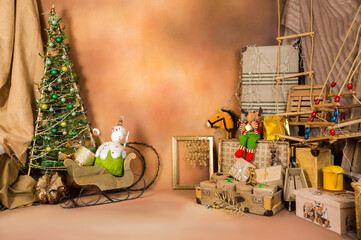 Christmas decoration with toys and ornaments on a brown textured background.