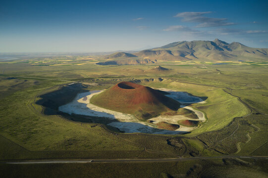 Aerial landscape of Meke Crater in Turkey. Stunned view of green valley with mountains and crater lake