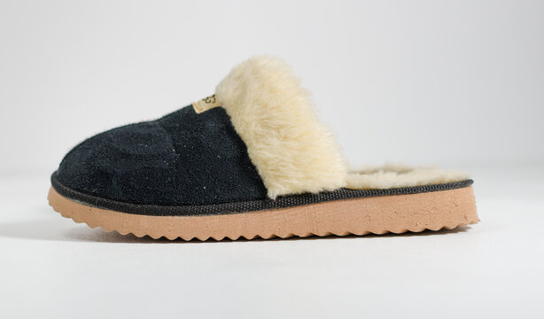 kent, uk, 09.09.2022 A pair of women sheepskin ugg furry comfy slippers. Fashionable uff sheep skin boots and footwear. Australian famous export fashion. UGG boots.