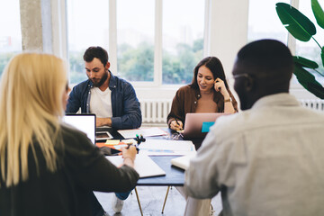 Inspired colleagues collaborating on new project