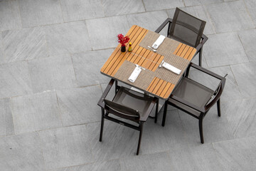 The set of table be prepared for meal with fork and spoon , top view style. 