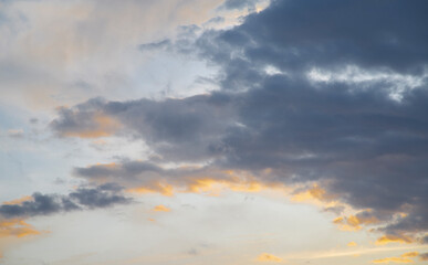 Sky with light and dark clouds at sunset