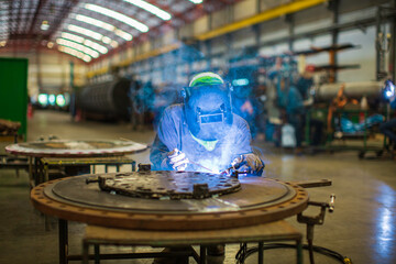 Welding arc argon worker male repaired metal is welding sparks industrial construction repair plate