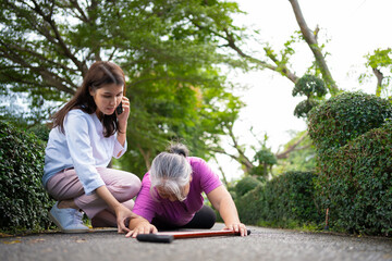 Asian senior woman fell down on lying floor because faint and limb weakness and pain from accident...