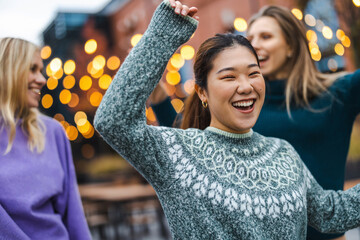 Group of female friends having fun in the city
