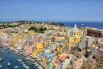 Procida island, Naples, Italy, colorful houses in Marina di Corricella harbour on sunrise light