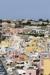 Procida island, Naples, Italy, colorful houses in Marina di Corricella harbour on sunrise light